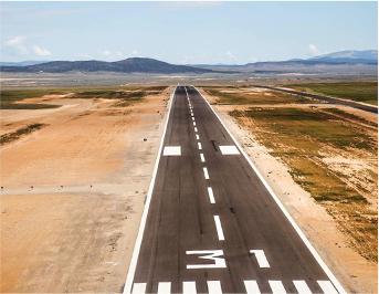 Aerial view of runway with mountains