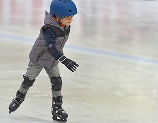 Young boy ice skating